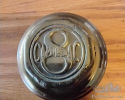 Brass early Cadillac V8 hubcap