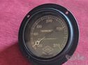 A rare ARIC flange mounted water temperature gauge as used by WO Bentley and similar.