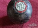 A rare early hardwood gearknob with enamel MG badge inlayed.