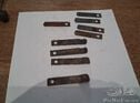 A set of 9 remanufactured springs for the door handles for Peugeot 202.